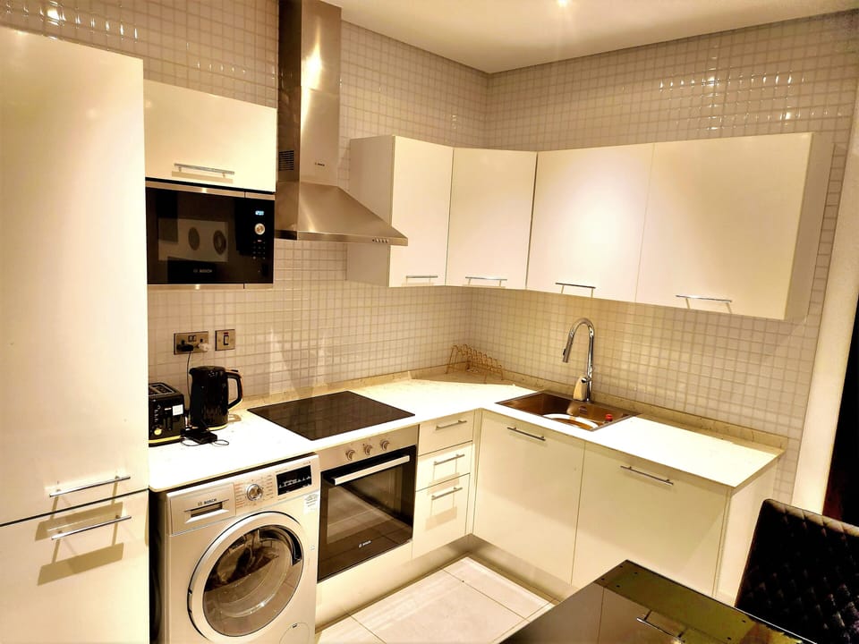 Luxury Apartment, City View | Private kitchen | Full-size fridge, microwave, oven, dishwasher