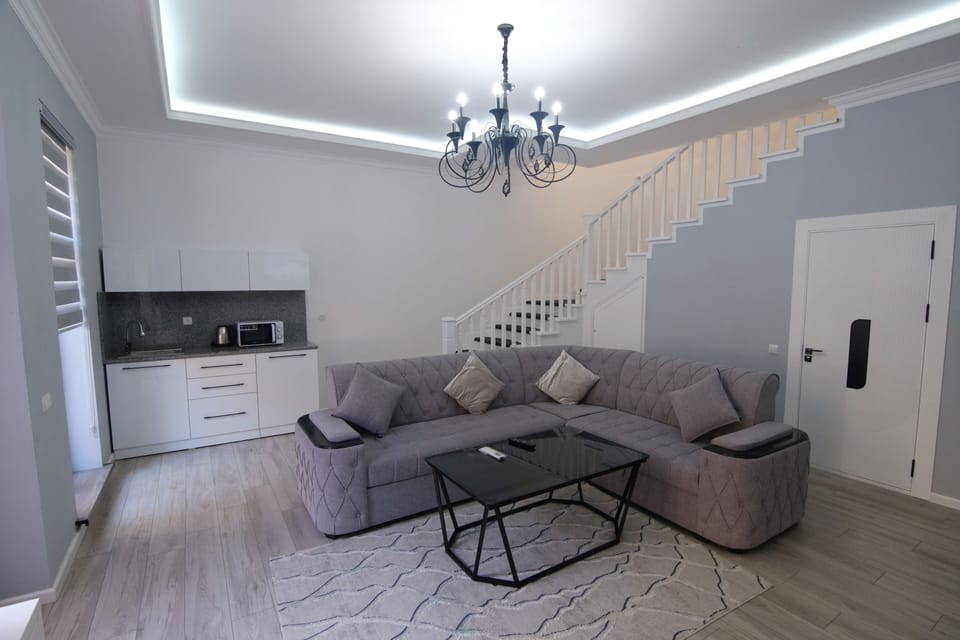 Family Quadruple Room, Pool View | Living area | 1000-cm Smart TV with digital channels