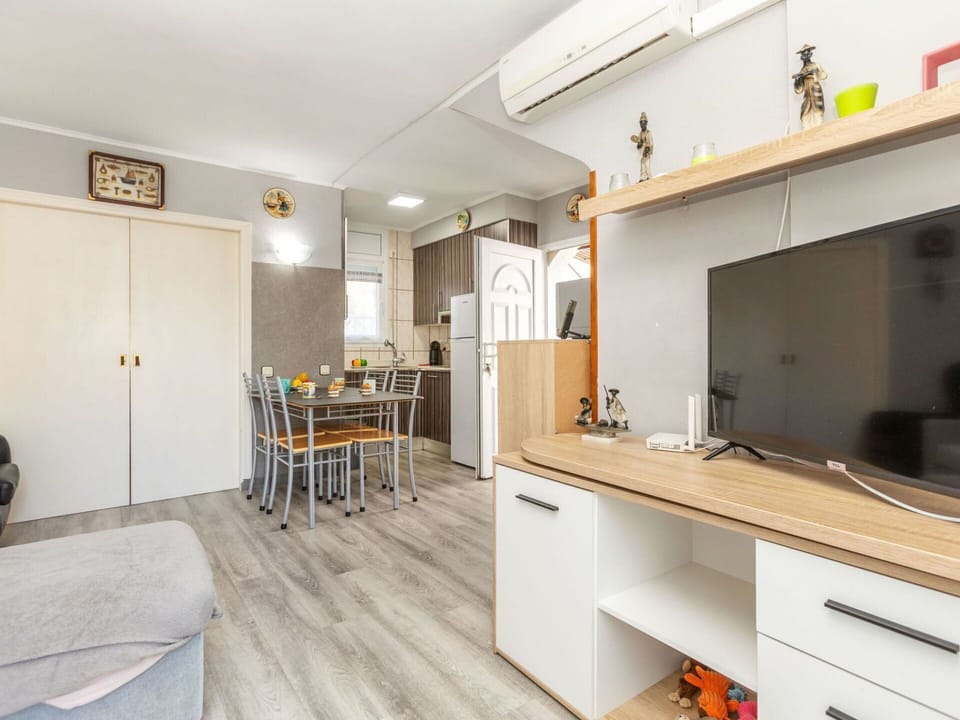 Flooring, Furniture, Floor, Apartment, Kitchen, Countertop, Major Appliance, Cabinetry, Cupboard, Chair