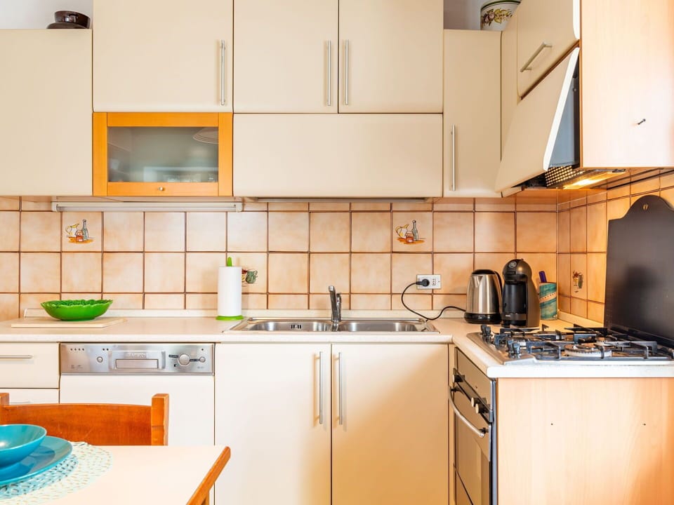 Kitchen Sink, Cabinetry, Sink, Countertop, Tap, Kitchen Stove, Kitchen Appliance, Kitchen, Home Appliance, Interior Design