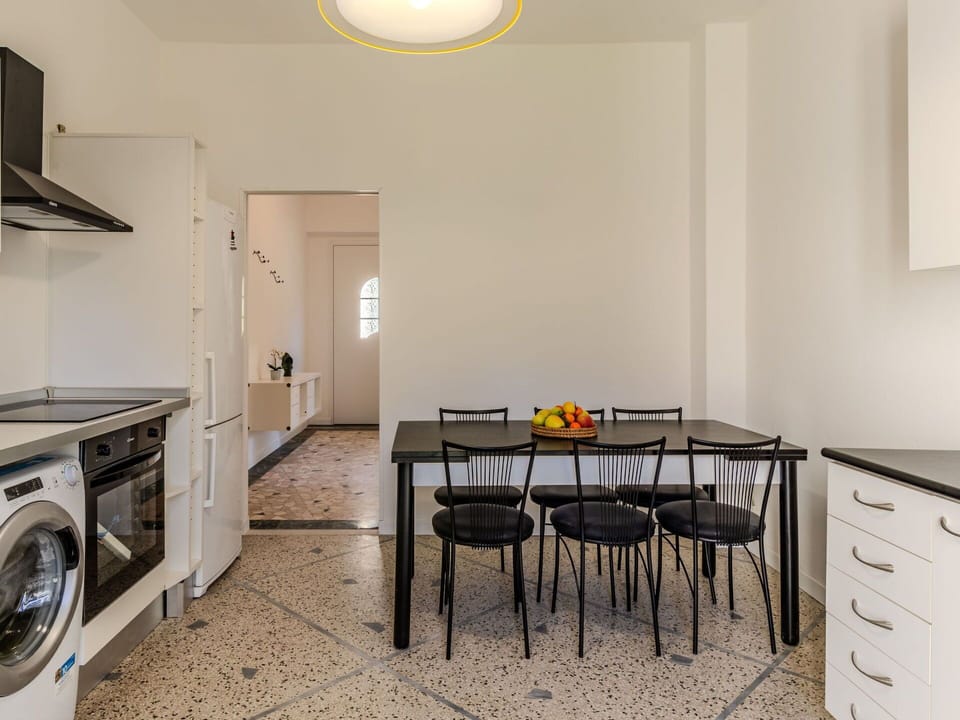 Furniture, Laundry Room, Property, Cabinetry, Table, Countertop, Wood, Lighting, Clothes Dryer, Chair