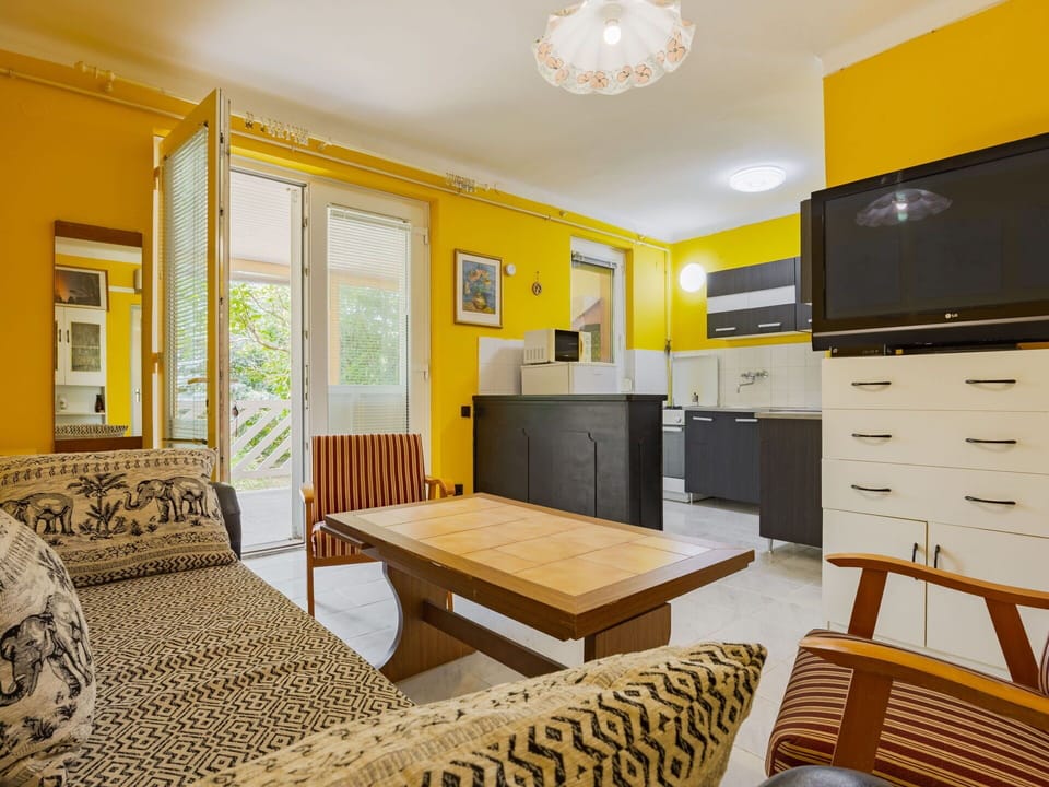 Furniture, Interior Design, Wall, Flooring, Floor, Wood, Ceiling, Yellow, Room, Couch