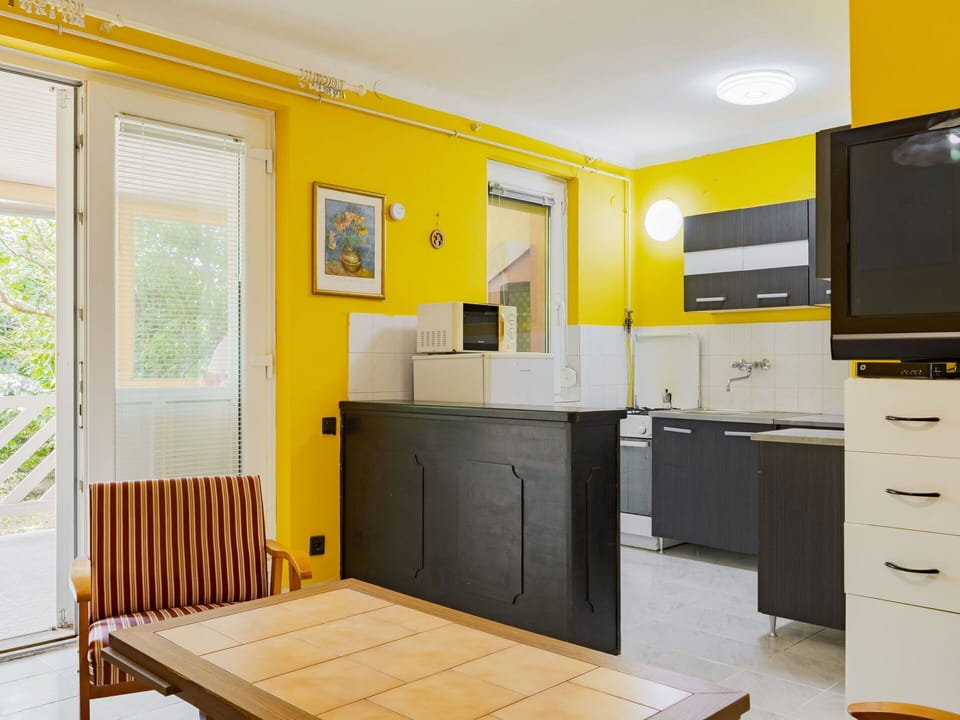 Furniture, Interior Design, Flooring, Wood, Floor, Ceiling, Yellow, Room, Lighting, Apartment