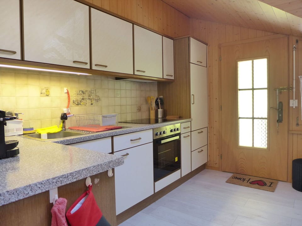 Cabinetry, Countertop, Property, Furniture, Building, Sink, Tap, Kitchen Stove, Kitchen Appliance, Kitchen