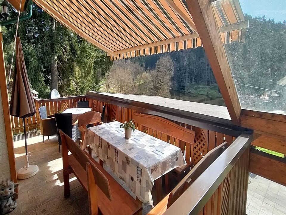 Wood, Table, Interior Design, Shade, Tree, Outdoor Furniture, Building, Hardwood, Real Estate, Leisure
