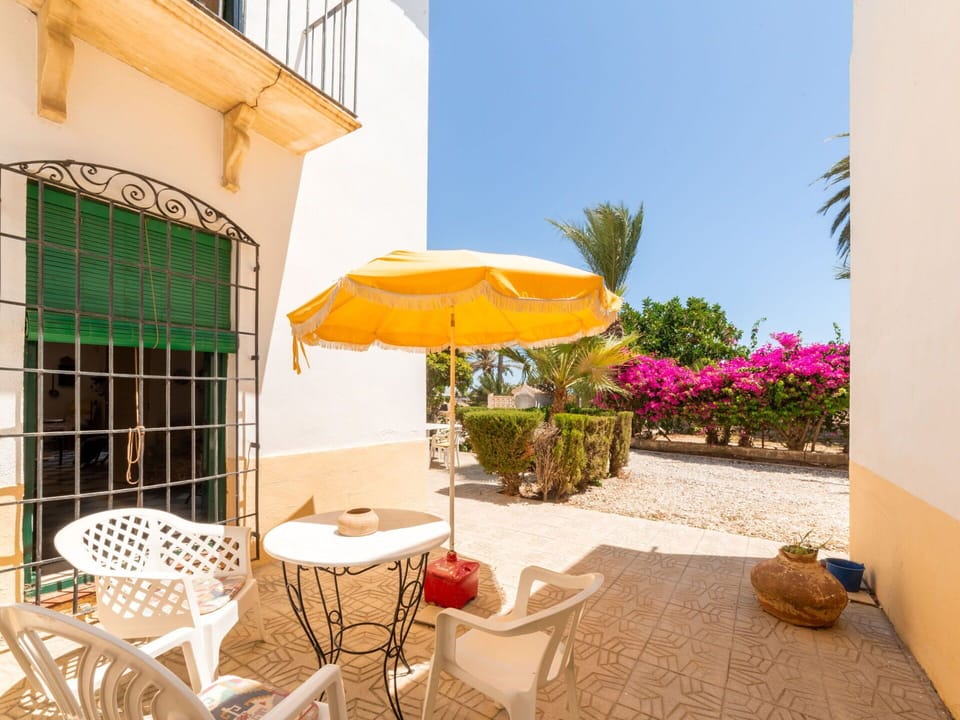 Plant, Property, Building, Furniture, Sky, Table, Chair, Shade, Outdoor Furniture, Umbrella