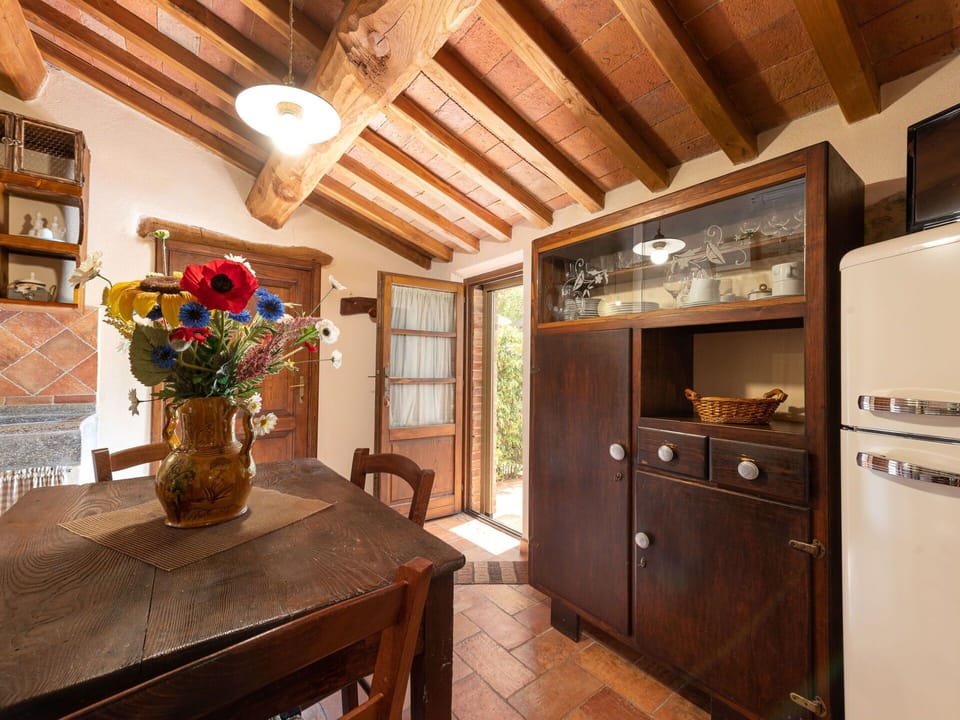 Furniture, Property, Table, Cabinetry, Wood, Kitchen Appliance, Drawer, Flower, Picture Frame, Houseplant