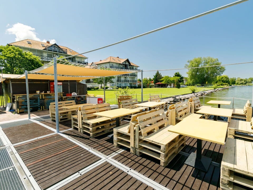 Sky, Shade, Wood, Building, Urban Design, Tree, Leisure, House, Outdoor Furniture, Real Estate