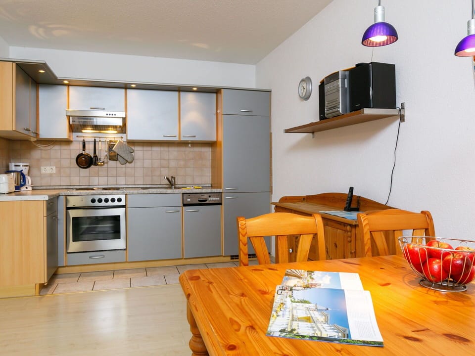 Property, Cabinetry, Blue, Countertop, Wood, Lighting, Kitchen Stove, Kitchen, Table, Interior Design
