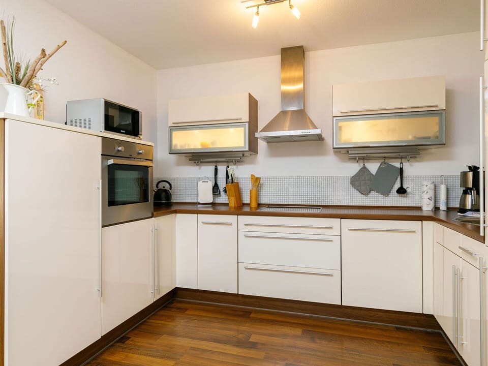 Cabinetry, Countertop, Property, Picture Frame, Kitchen, Home Appliance, Wood, Lighting, Interior Design, Floor