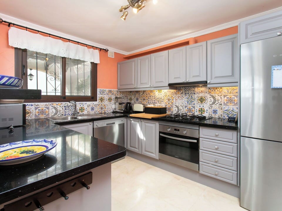 Kitchen, Countertop, Kitchen Appliance, Cabinetry, Major Appliance, Interior Design, Kitchen Stove, Furniture, Stove, Flooring