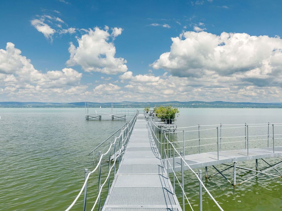 Cloud, Water, Sky, Water Resources, Nature, Azure, Natural Landscape, Fence, Vegetation, Coastal And Oceanic Landforms