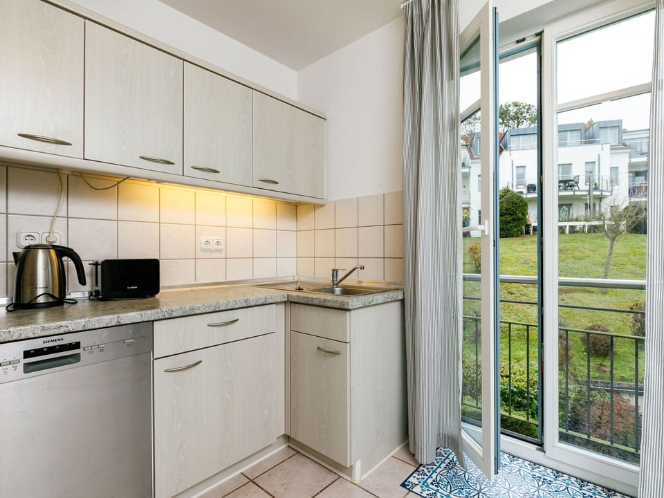 Cabinetry, Property, Countertop, Building, Kitchen Sink, Kitchen Stove, Kitchen Appliance, Cooktop, Interior Design, Stove