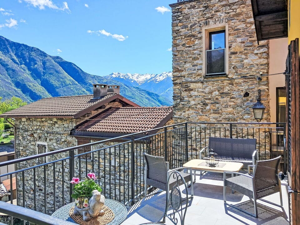 Sky, Cloud, Property, Building, Furniture, Window, Azure, Mountain, Flowerpot, Table