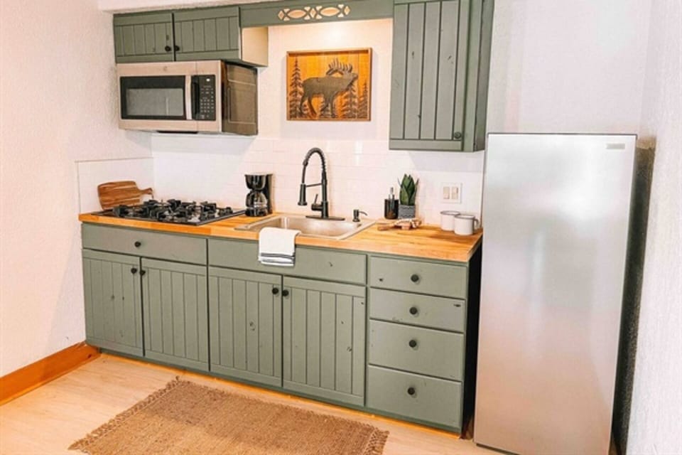 Quaint Kitchen: Modern Essentials Included.