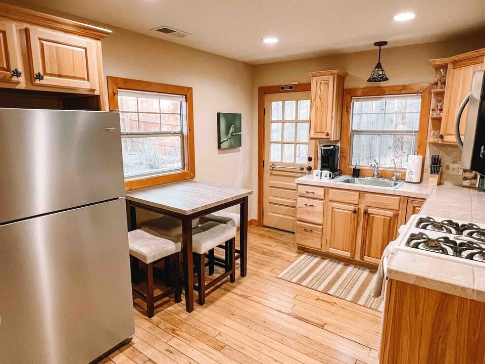 Whip up culinary delights in our fully stocked kitchen, complete with modern appliances. Perfect for gourmet adventures or simple meals.