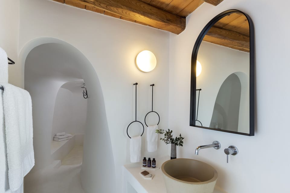 Shower, designer toiletries, hair dryer, bathrobes