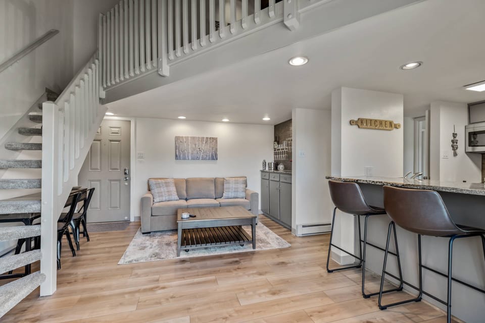 Open living space with stairs up the loft space.