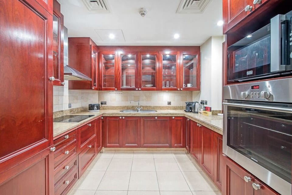 Gourmet Kitchen: Craft culinary masterpieces in this elegant space with rich wood and modern appliances!