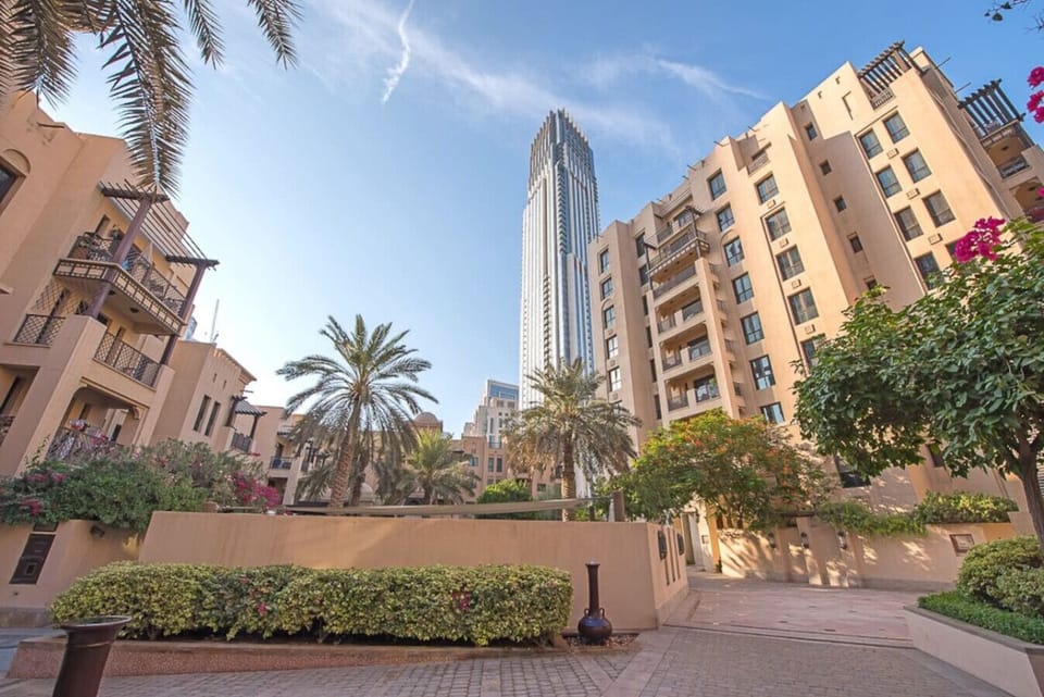Exterior Oasis: Experience lush gardens with a stunning skyline backdrop—paradise awaits!