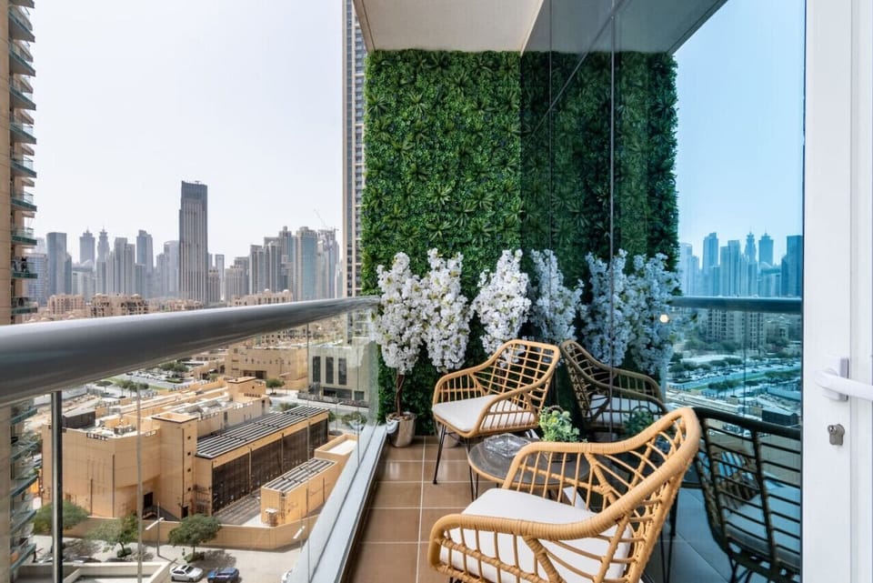 Balcony Retreat: Enjoy dazzling skyline views while surrounded by vibrant greenery and blooms!