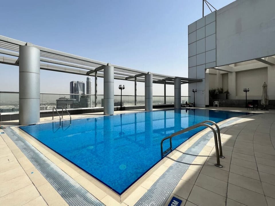 Rooftop Pool Paradise: DRooftop Oasis: Splash into luxury with panoramic skyline views in the heart of Dubai!ive into stunning skyline views under the warm Dubai sun!