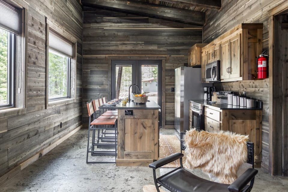 The dining area invites memorable meals, while the fully equipped kitchen stands ready to inspire culinary adventures.