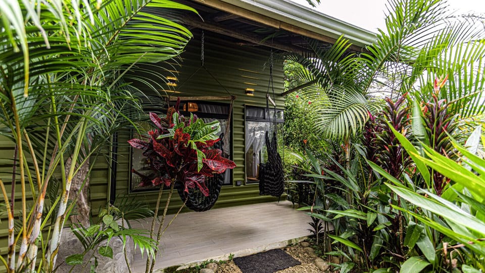 Patio w/hammock swings and wrapped in gardens