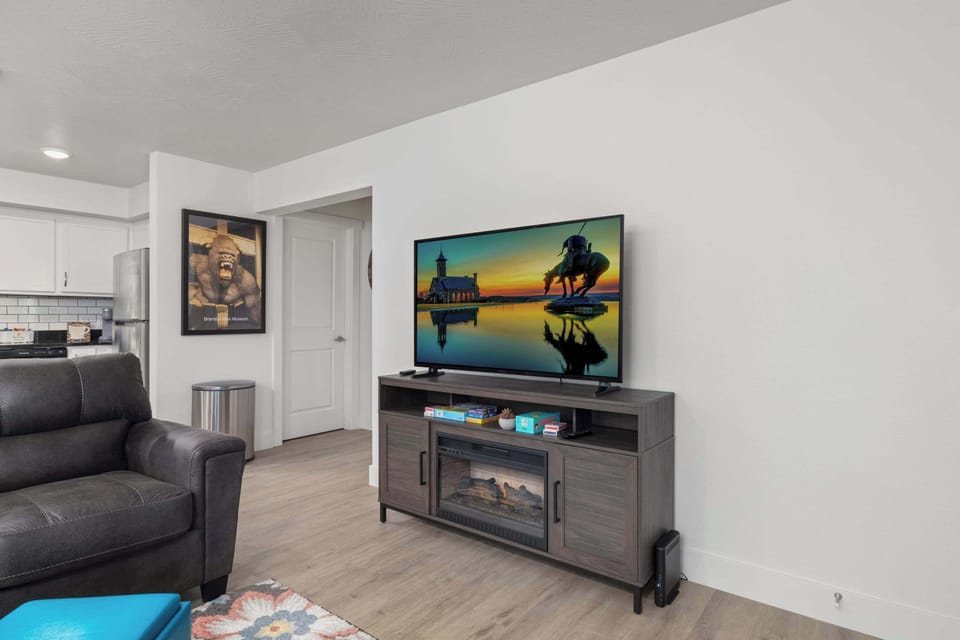 Enjoy the warmth of the electric fireplace while spending time in the living room.