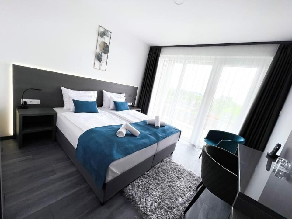 Deluxe Double Room | In-room safe, desk, laptop workspace, blackout drapes
