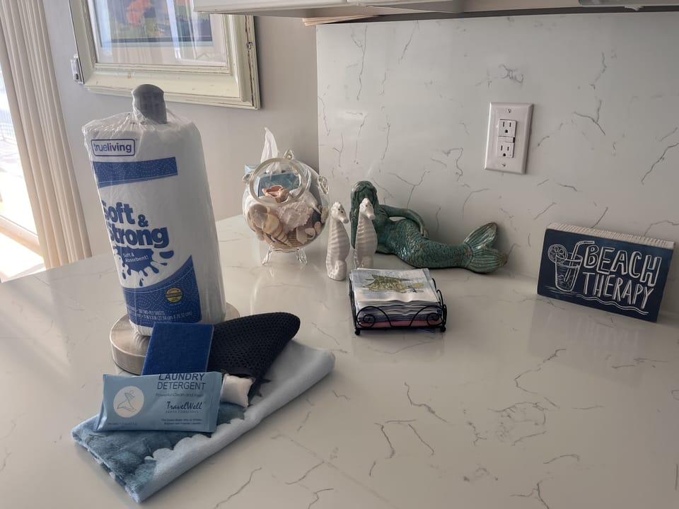 Kitchen amenity kit - paper towels, sponge, laundry detergent, etc. Plus extras!