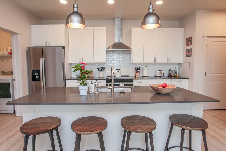 Take a seat at the island or the dining table