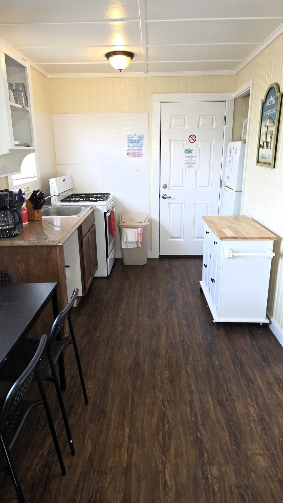 The cottage has a full kitchen with basic cookware, soaps, and paper products