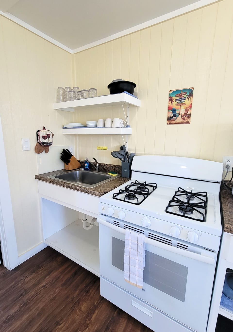 You'll find a refrigerator, gas stove, microwave, and coffee maker