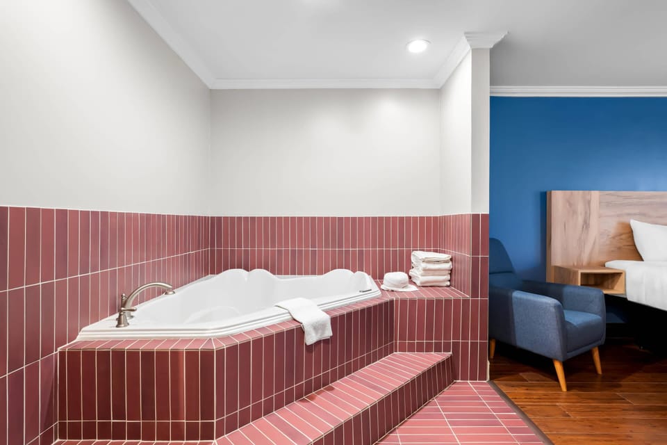 Suite, 1 King Bed, Non Smoking | Premium bedding, down comforters, blackout drapes, iron/ironing board
