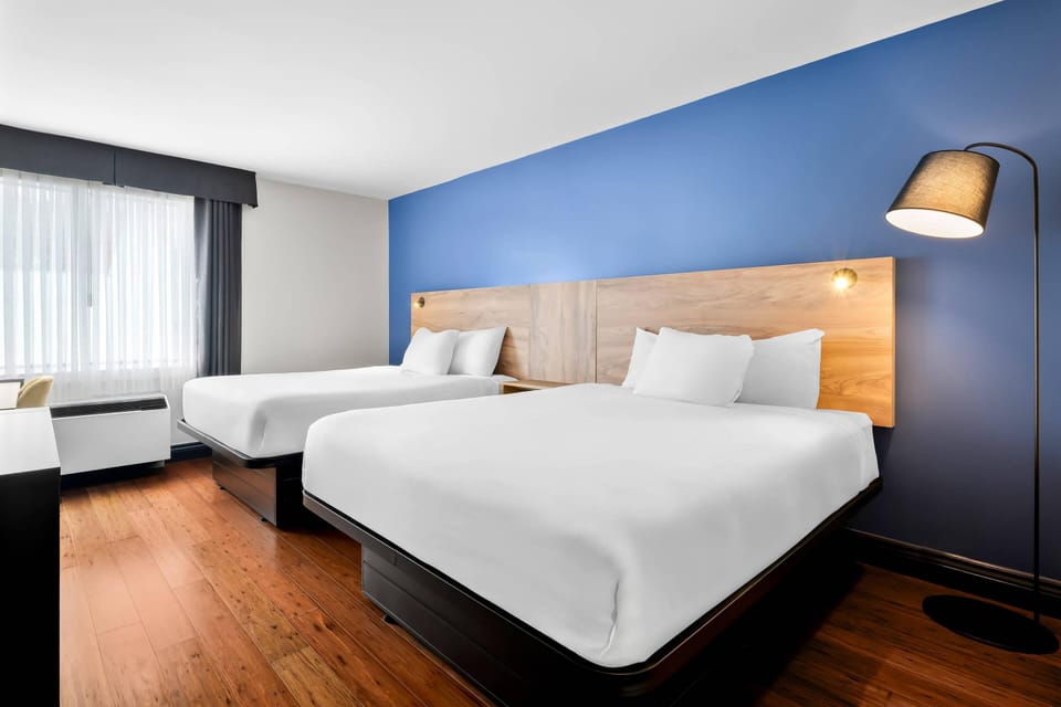 Standard Room, 2 Queen Beds, Non Smoking | Premium bedding, down comforters, blackout drapes, iron/ironing board