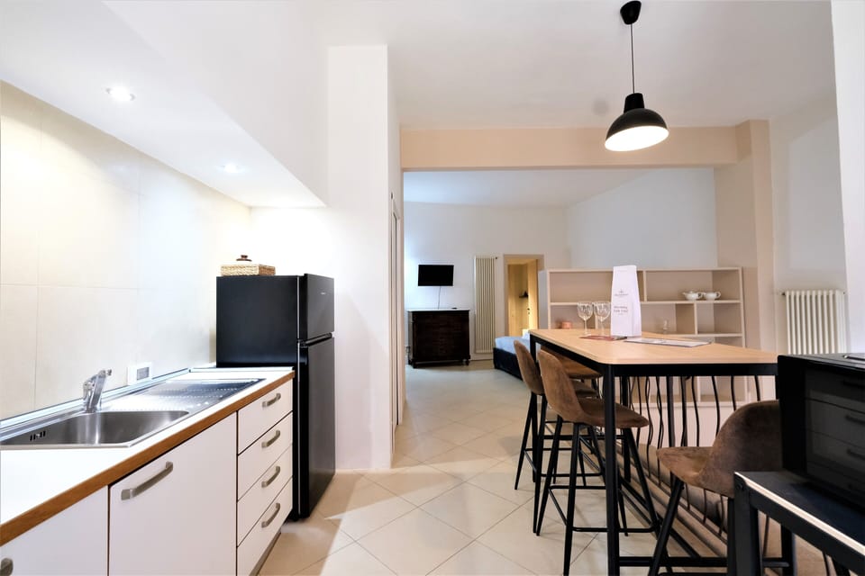 City Apartment | Living area | 35-inch flat-screen TV with satellite channels