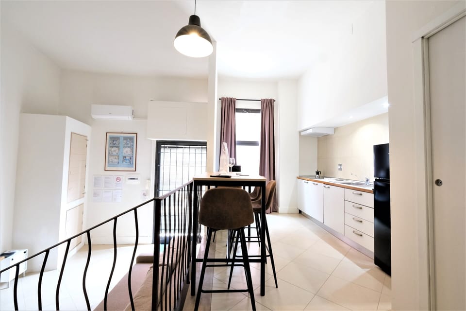 City Apartment | Living area | 35-inch flat-screen TV with satellite channels