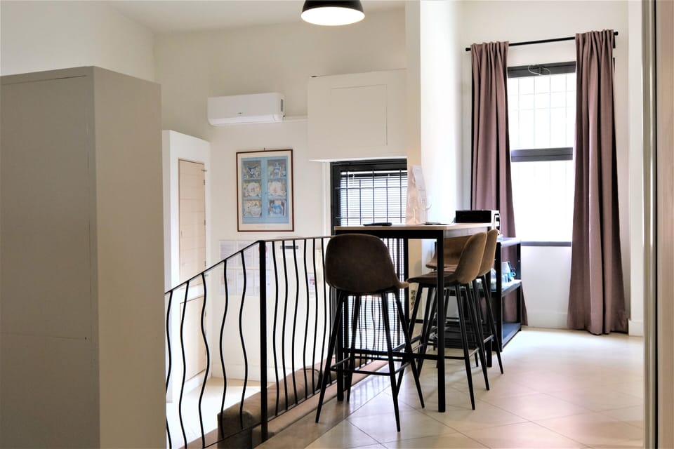 City Apartment | Living area | 35-inch flat-screen TV with satellite channels
