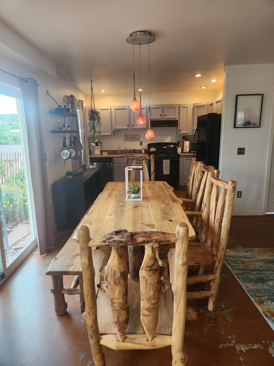 The dining room features a custom designed log dining set seating up to 8.
