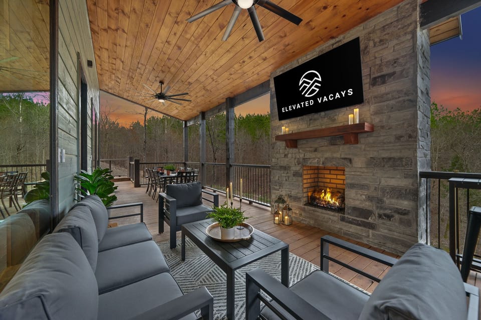 Discover a world of relaxation and entertainment on the main-floor patio – dining table for 8 with multiple extra benches and bar/barstool seating, plus a comfy seating area around the outdoor 65” TV and fireplace.