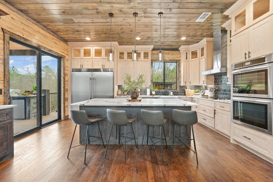 Barstool seating at the kitchen island supplements dining seating and provides a sweet spot to grab breakfast, a morning hot beverage, snacks, and lunch.