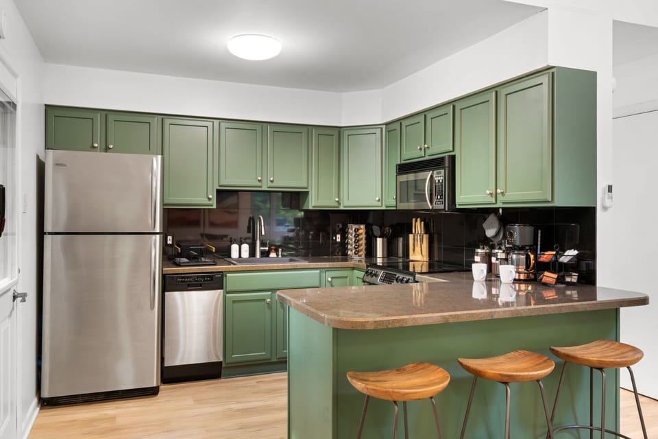 Fully equipped kitchen with fresh, modern flair.