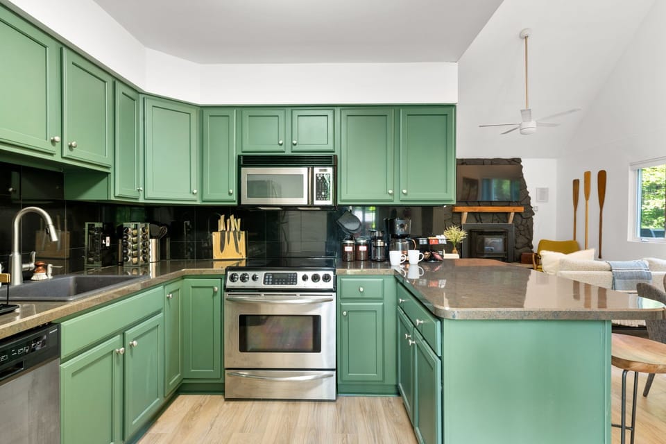 Fully equipped kitchen with a fresh pop of color.