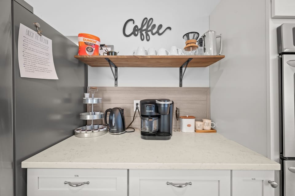 Coffee bar with k-cups and coffee grounds to get you started. A tea kettle, pour over, and french press are also available.