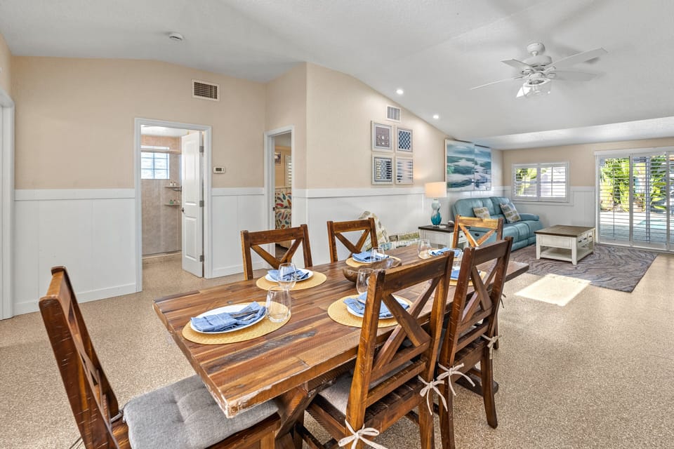 Gather around the table in a bright, airy space perfect for family meals and shared moments.