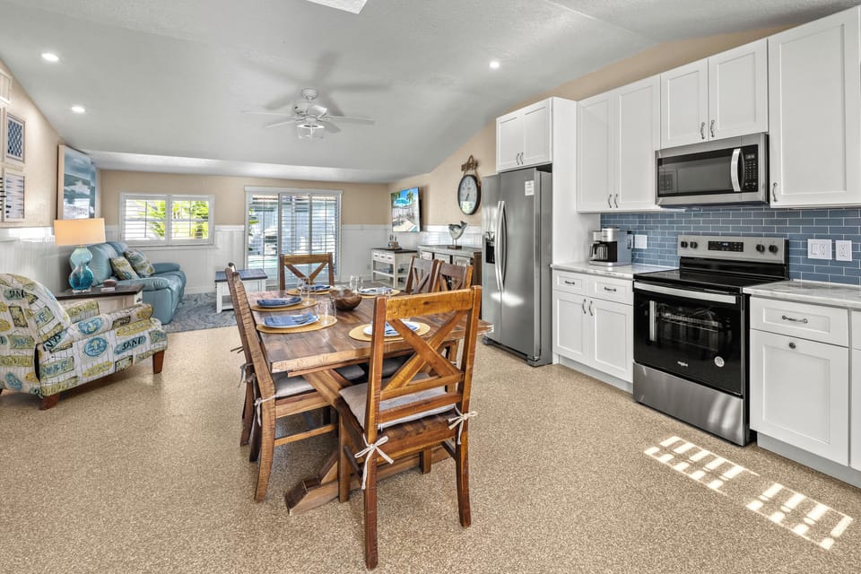Take in a bright, open space where the dining area flows seamlessly into the airy living room.
