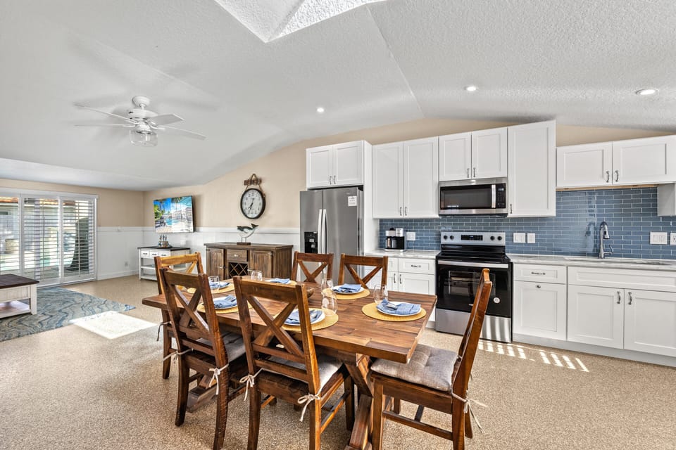 Cook, dine, and connect in a bright, open space designed for effortless family living.