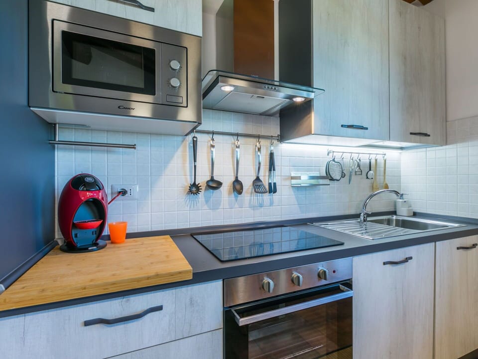 Kitchen Appliance, Kitchen, Countertop, Major Appliance, Cabinetry, Kitchen Sink, Home Appliance, Kitchen Stove, Stove, Interior Design
