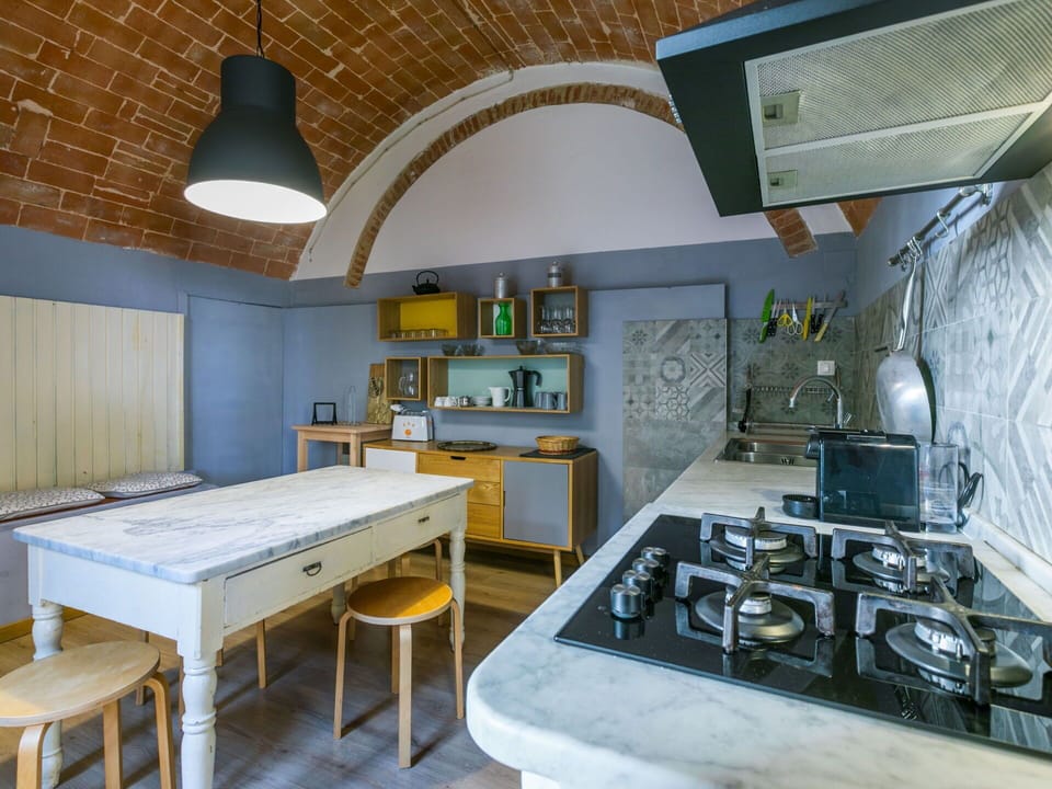 Furniture, Property, Cabinetry, Table, Countertop, Interior Design, Architecture, Floor, Flooring, Gas Stove